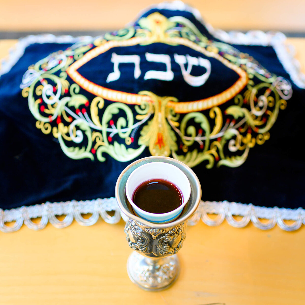 Details of a class of wine sitting on the bimah
