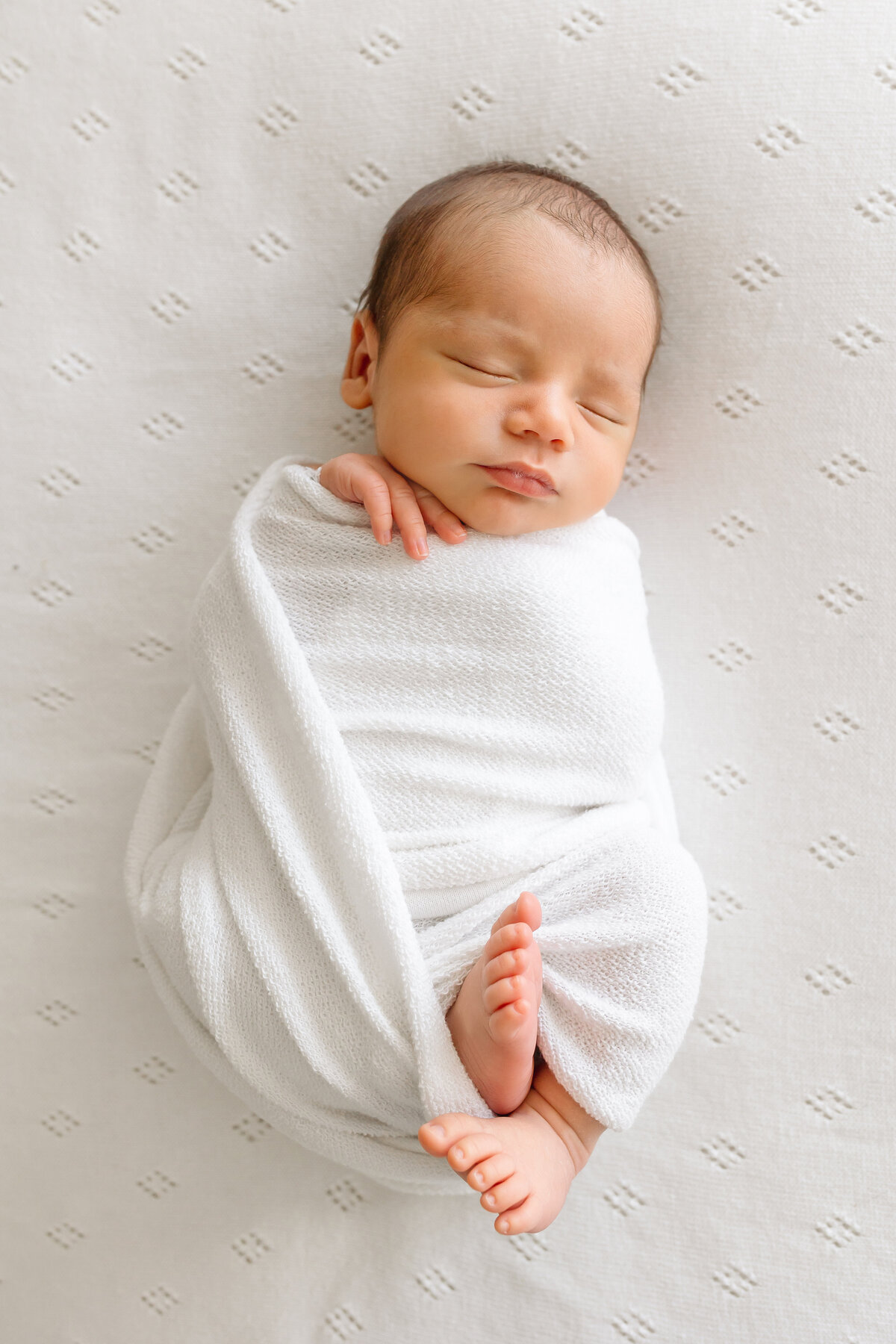 newborn wrapped in blanket