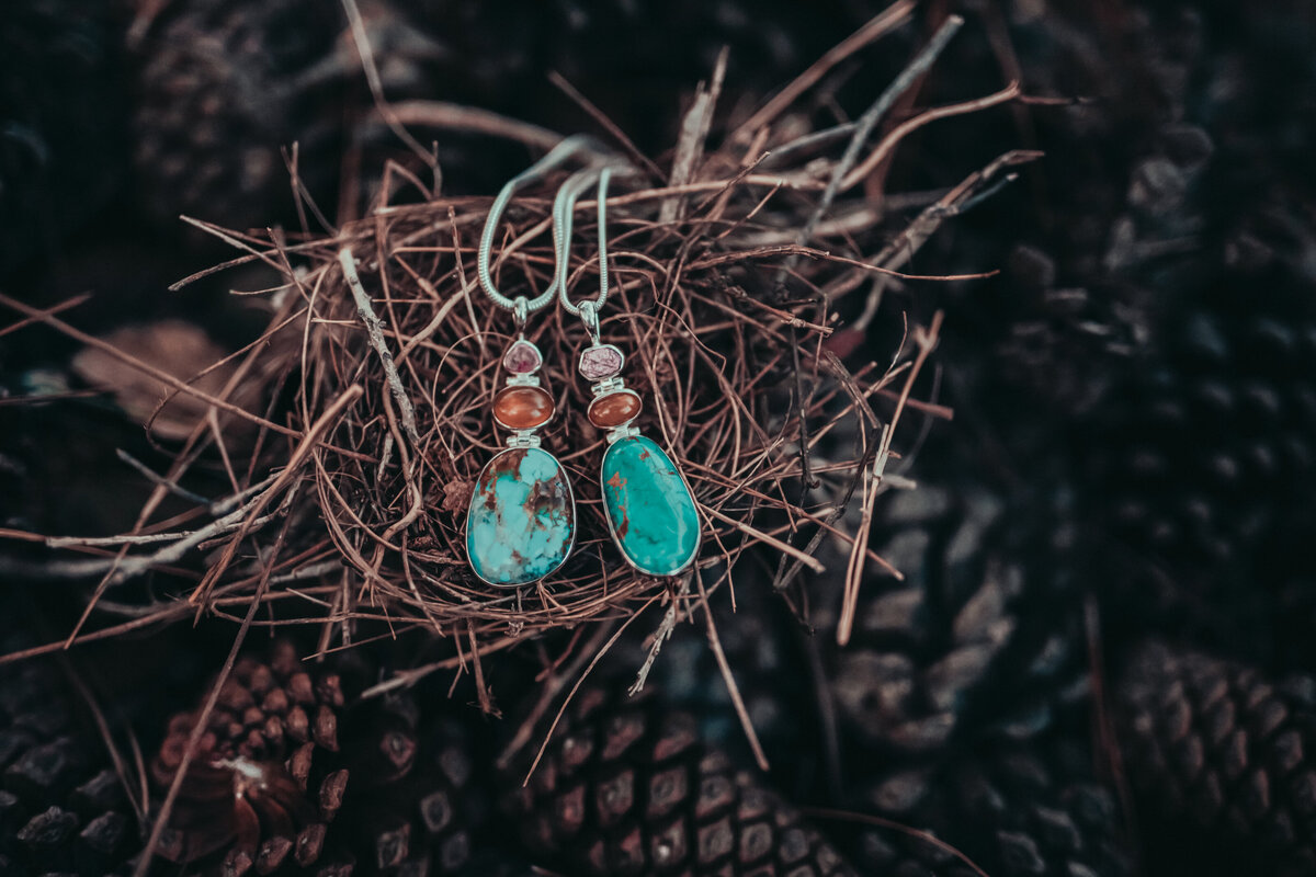 Necklace with elegant tone set against pine tree fruits