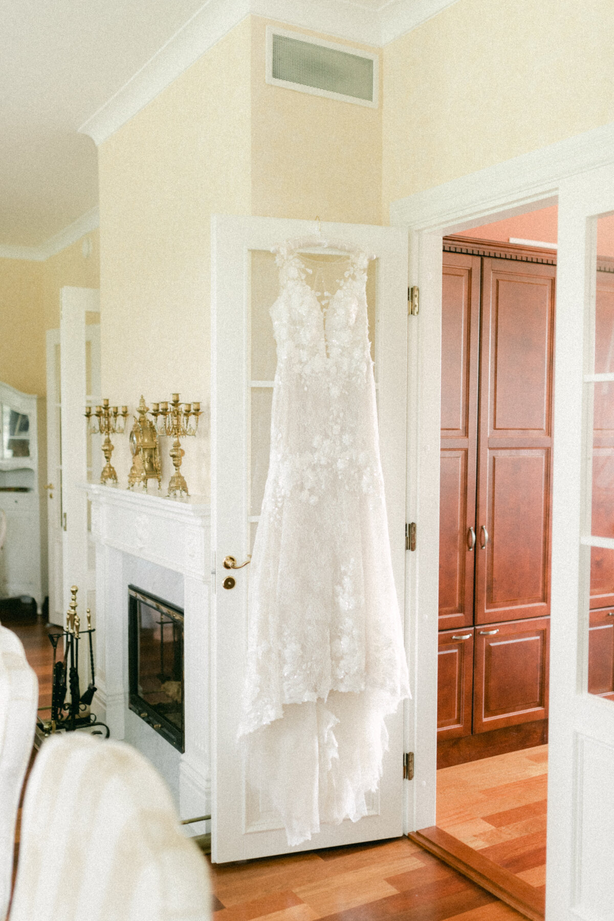 Wedding dress  hanging in the room photographed by wedding photographer Hannika Gabrielsson