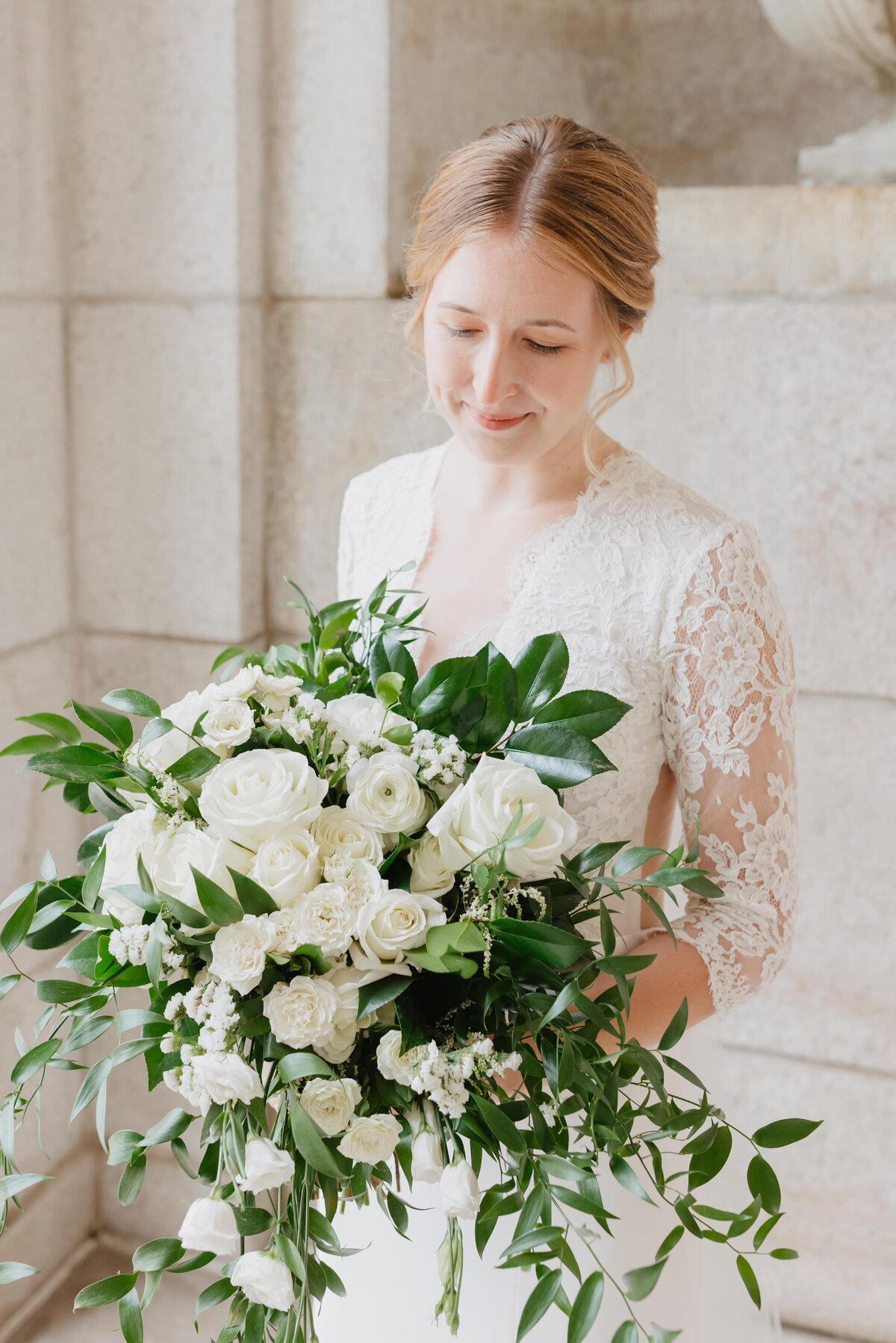 bride with lush white and green garden bouquet