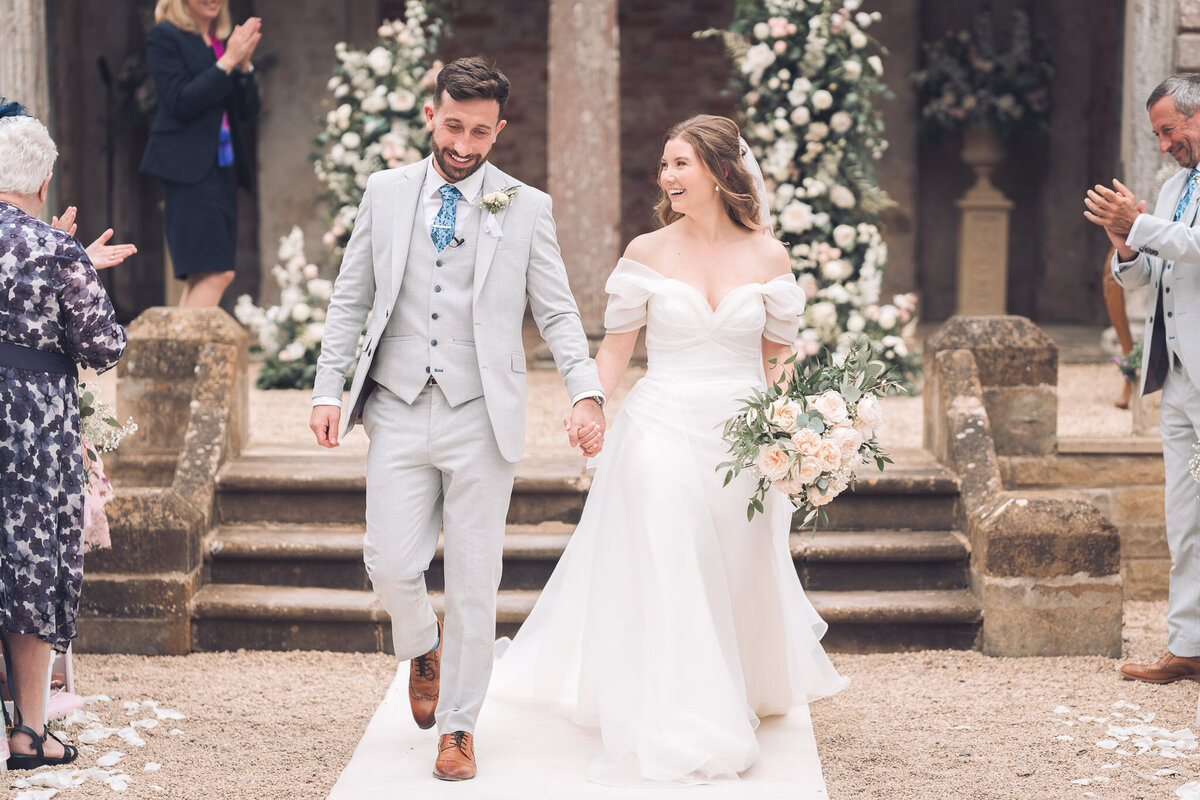 bride and groom walking down the aisle