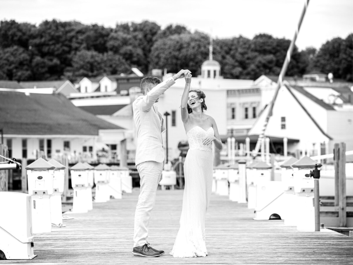 Bride and Groom dancing on boat docks