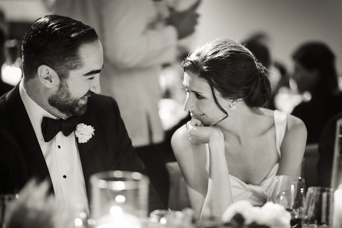 Couple looking at each other during wedding reception