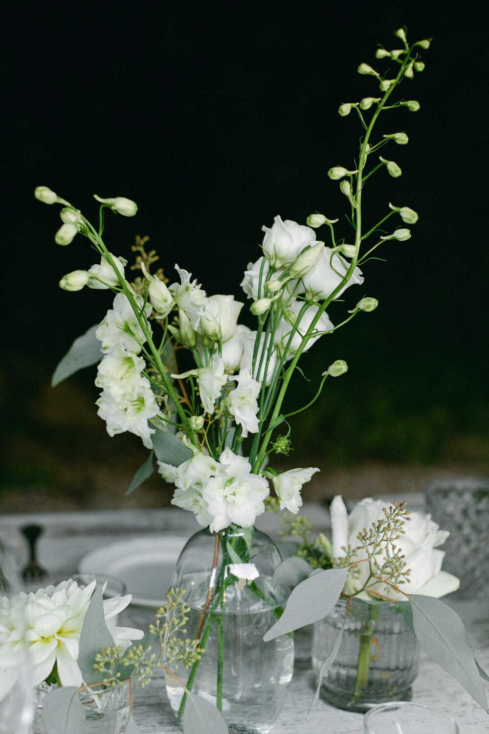white and green table top floral arrangement
