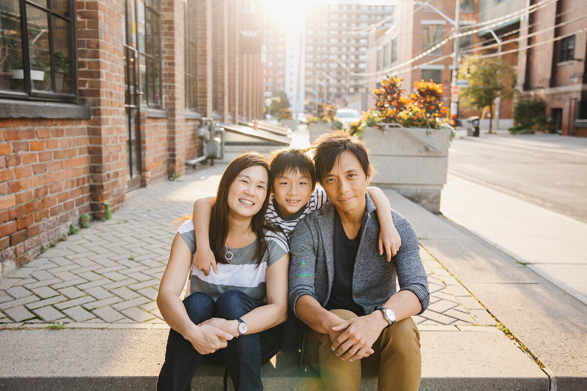 Family of 3 portrait in the city during sunset by Claire Binks Photography