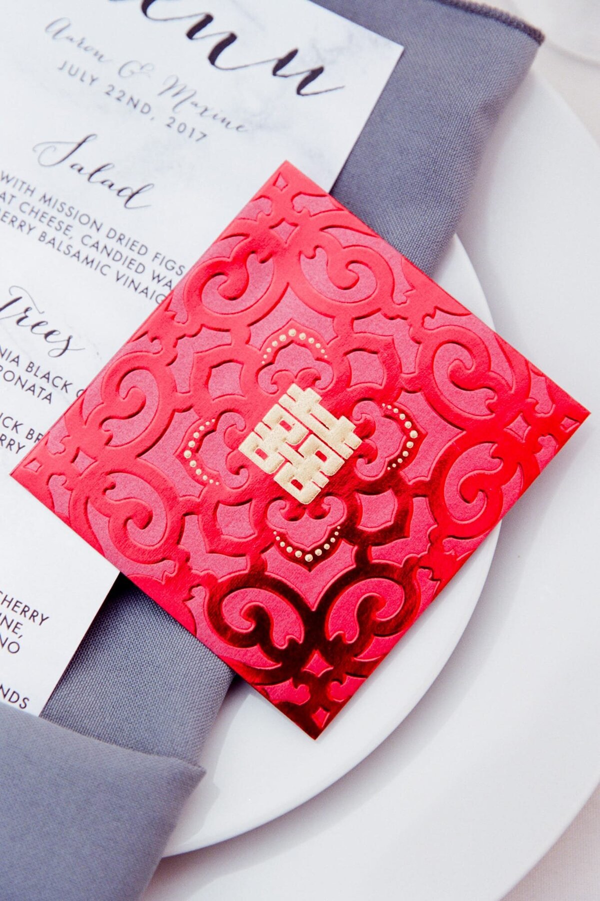 Wedding reception menu with a red card typical of Asian cultures.