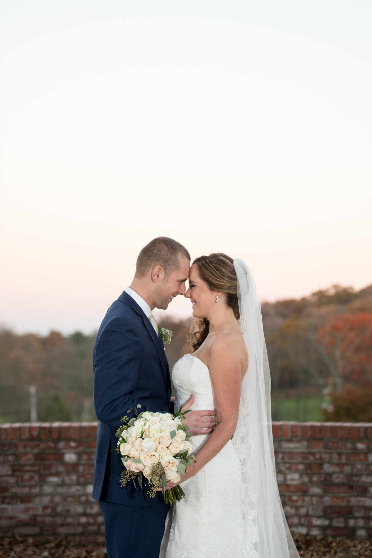 bride and groom looking into each other's eyes at Heritage Club at Bethpage