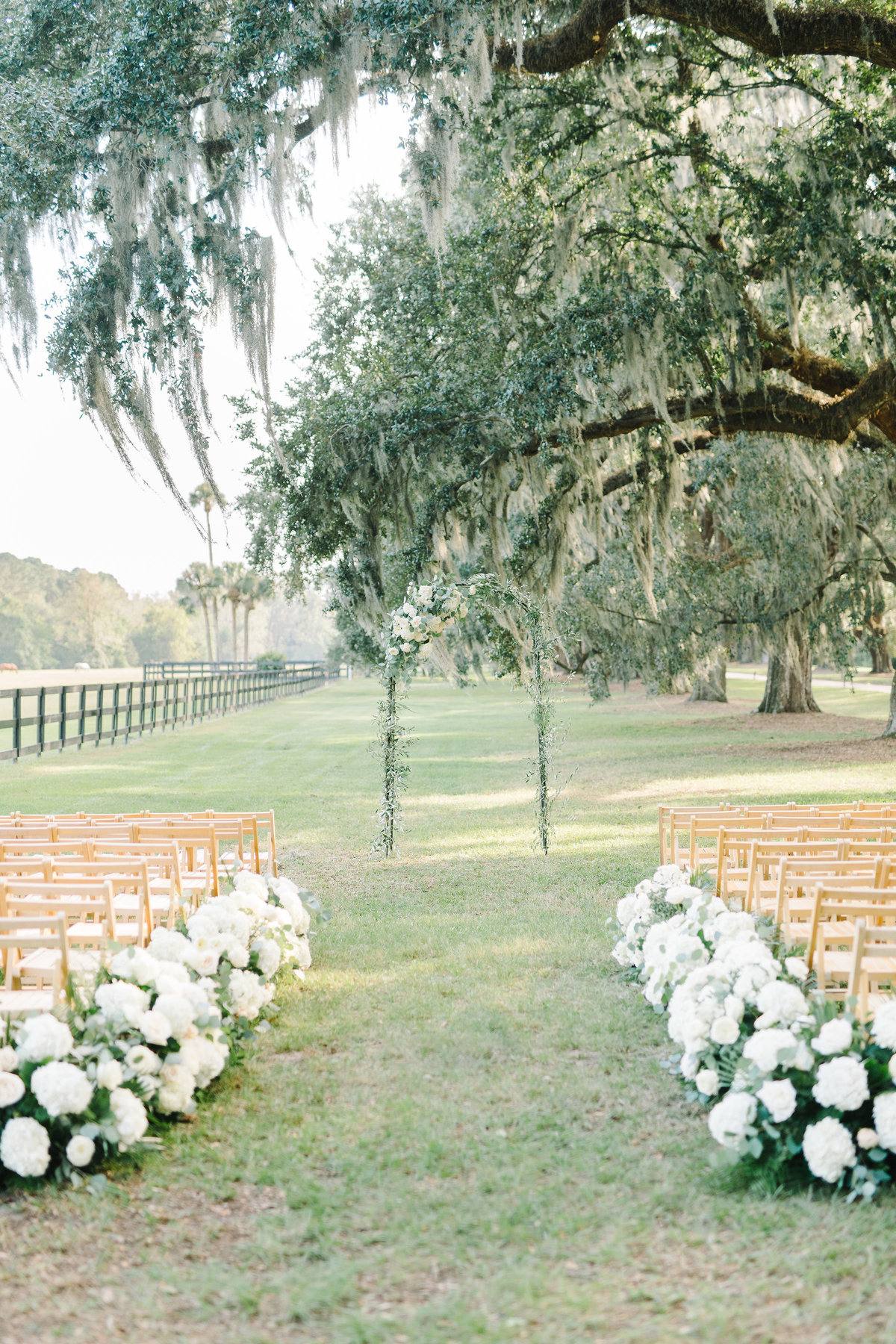 Wedding Ceremony Floral Lined Aisle with White Hydrangeas and Greenery Boone Hall Planation Avenue of Oaks
