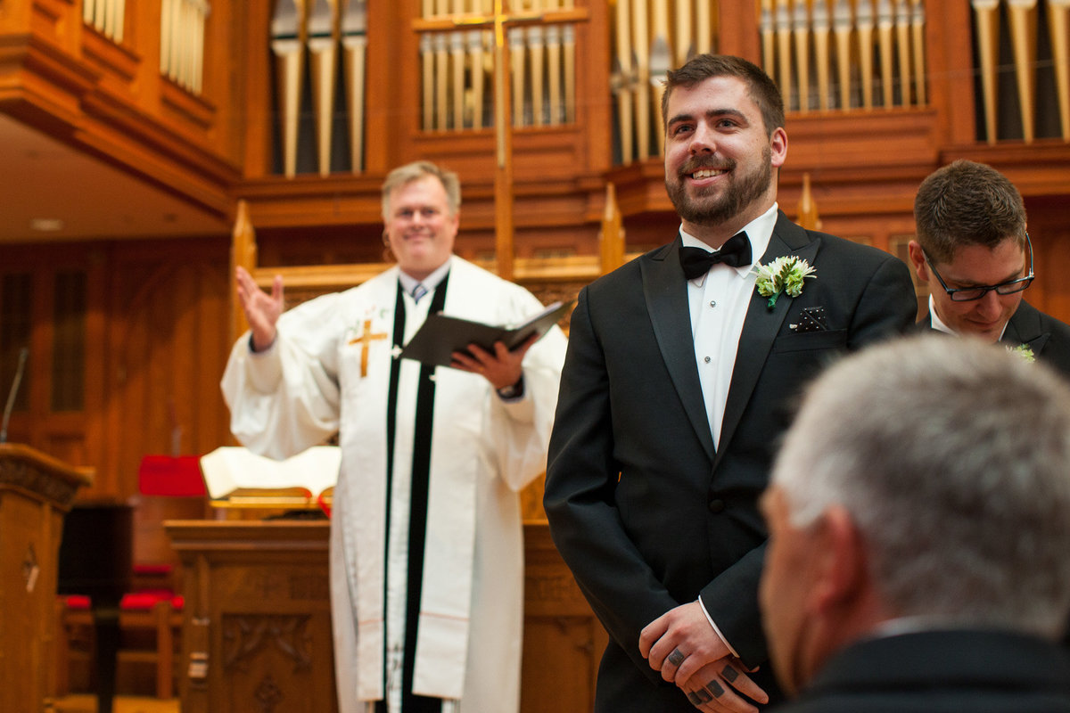 groom sees bride for first time as she comes down the aisle