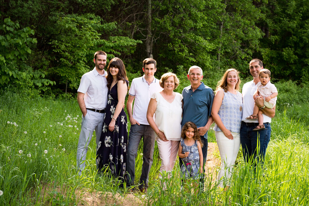 multi-generation extended family photo taken outside in a grassy field by Ottawa Family Photographer JEMMAN Photography
