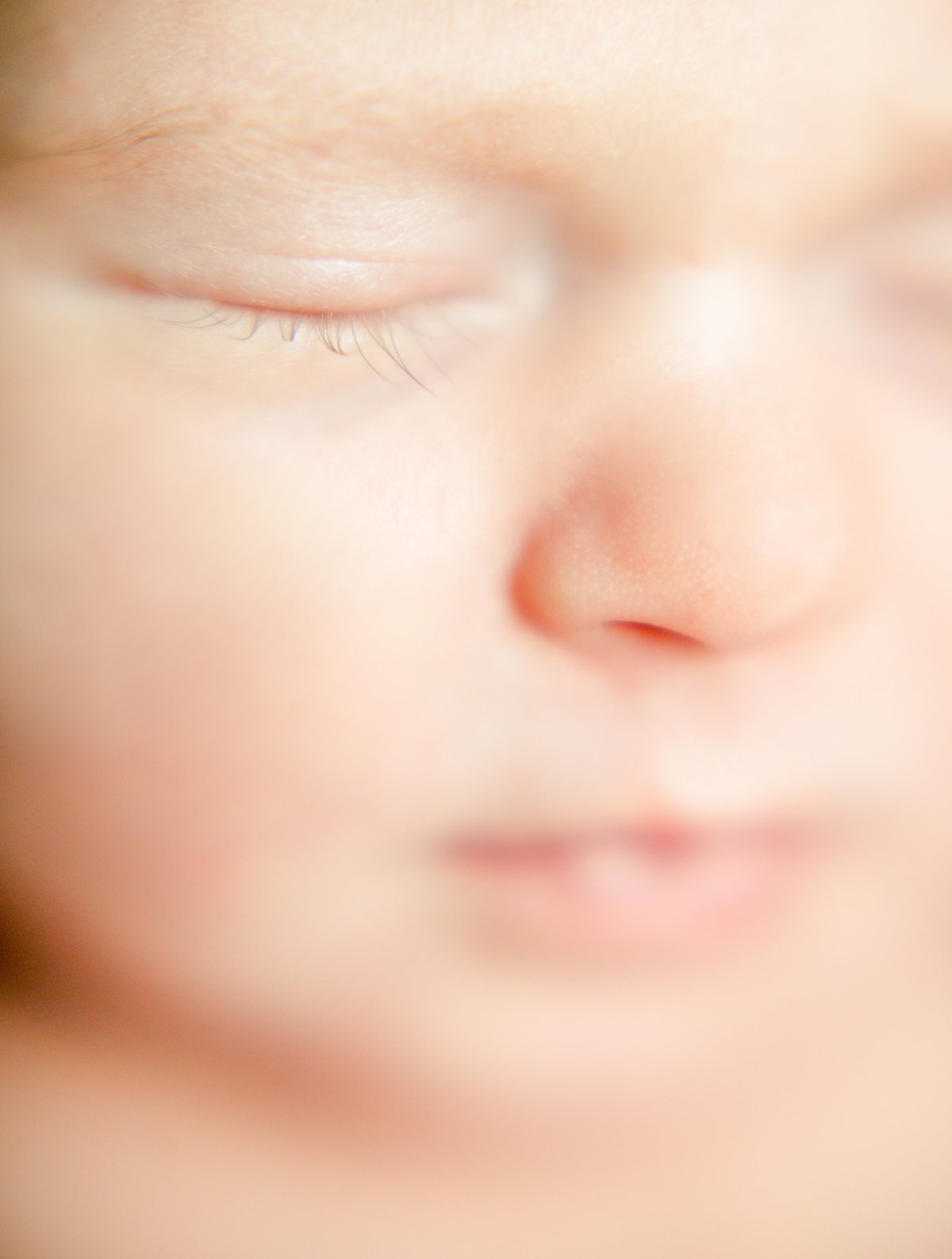 closeup of baby girls face for newborn portraits rochester minnesota