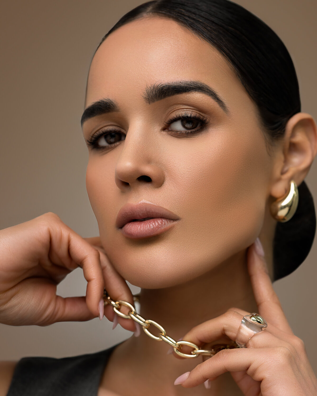 model wearing gold jewelry
