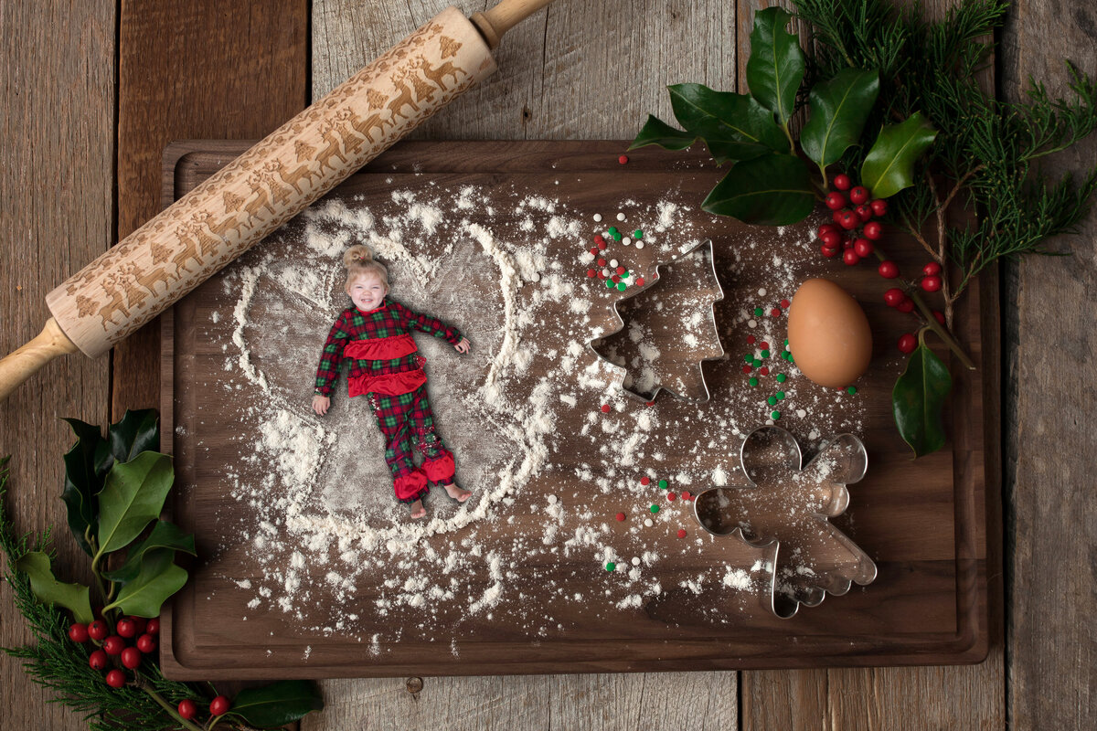 christmas scene of girl making flour angel