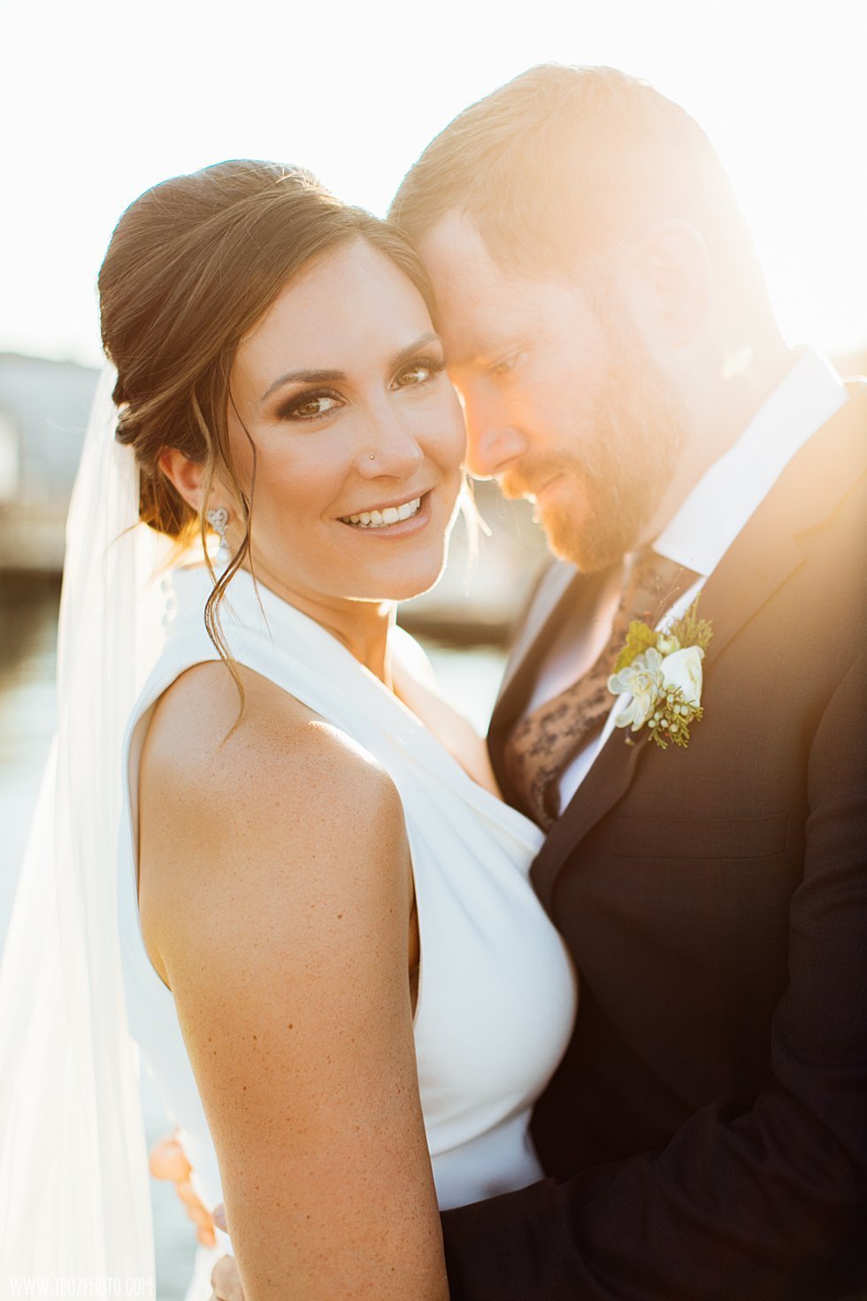 Golden sunflare on a Baltimore bride and groom
