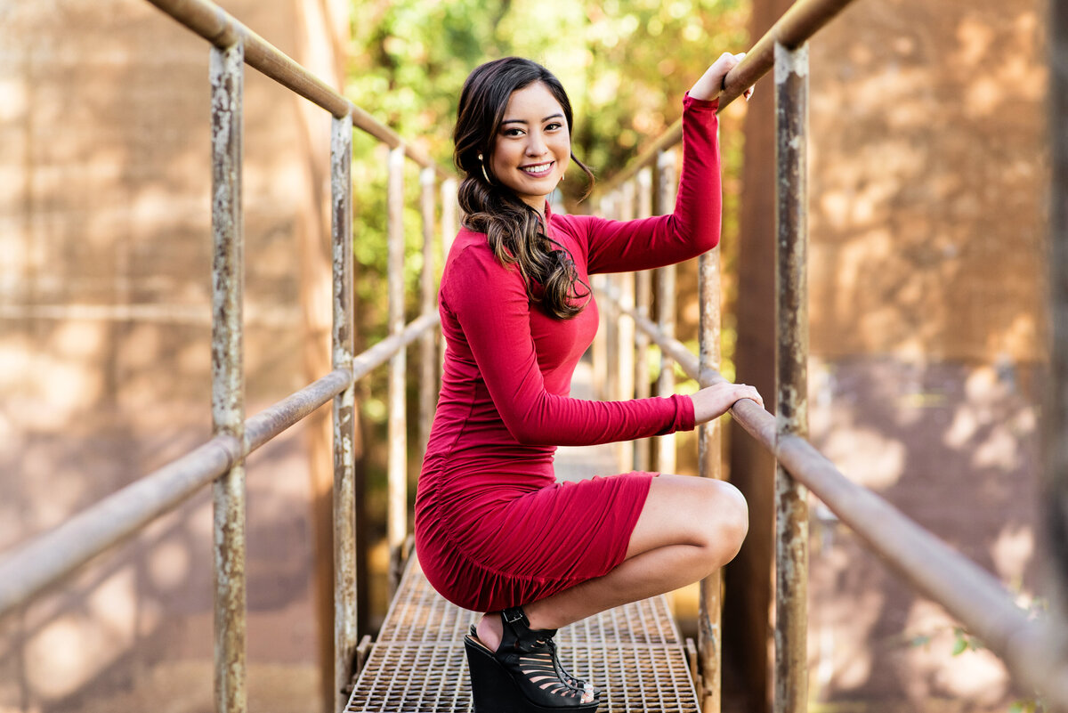 Senior girl poses on Pipeline walkway Richmond, VA for her senior pictures.