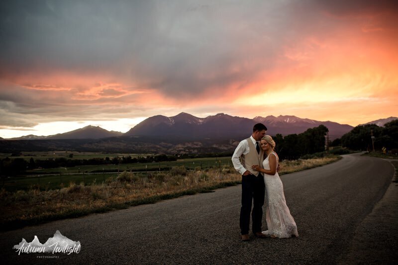 Everett Ranch Wedding Bride And Groom Hugging With A Mountain Sunset In Background