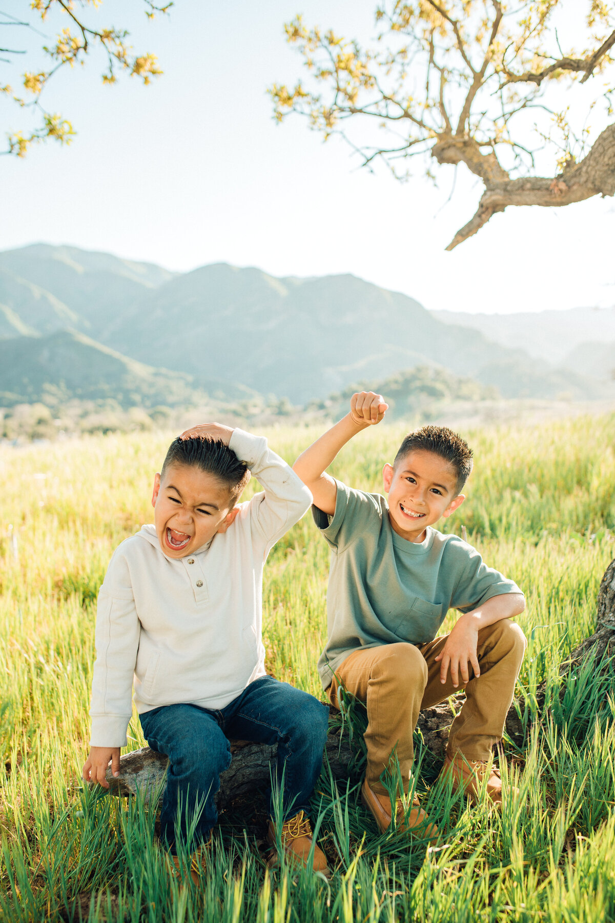 Family Portrait Photo Of Two Boys Sitting On The Ground While Playing  Los Angeles
