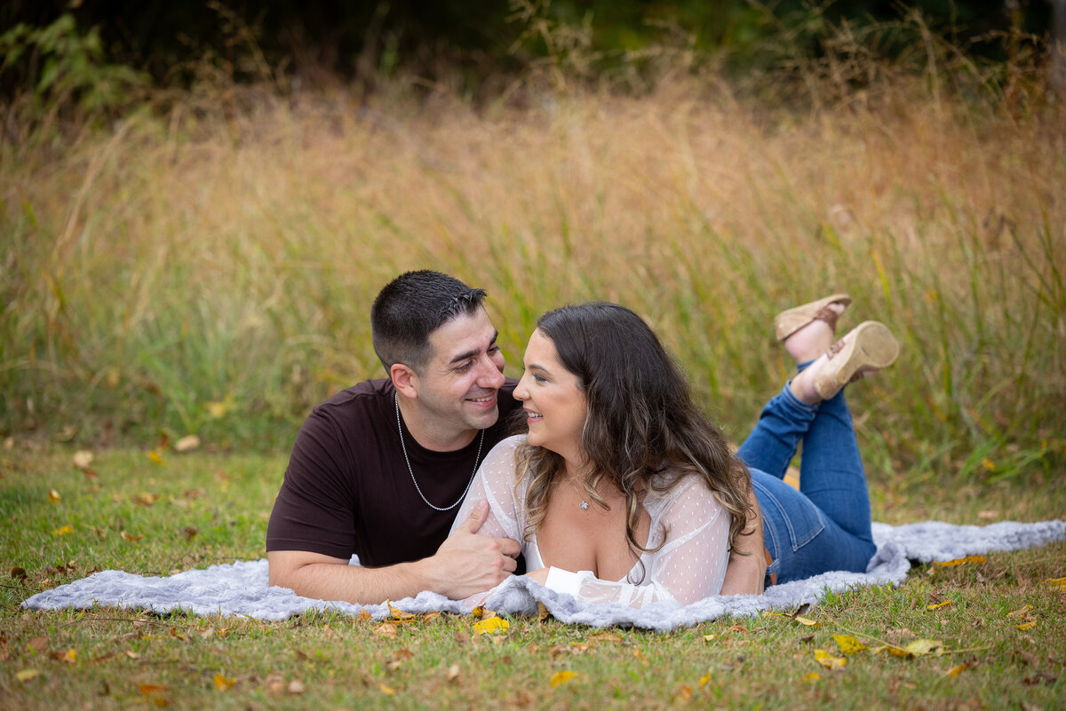 engagement-picnic-blanket-candid-lying-down-allaire-park