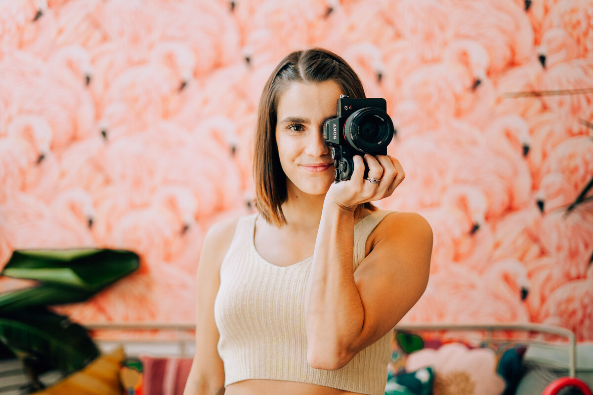 photographer smiling holding camera