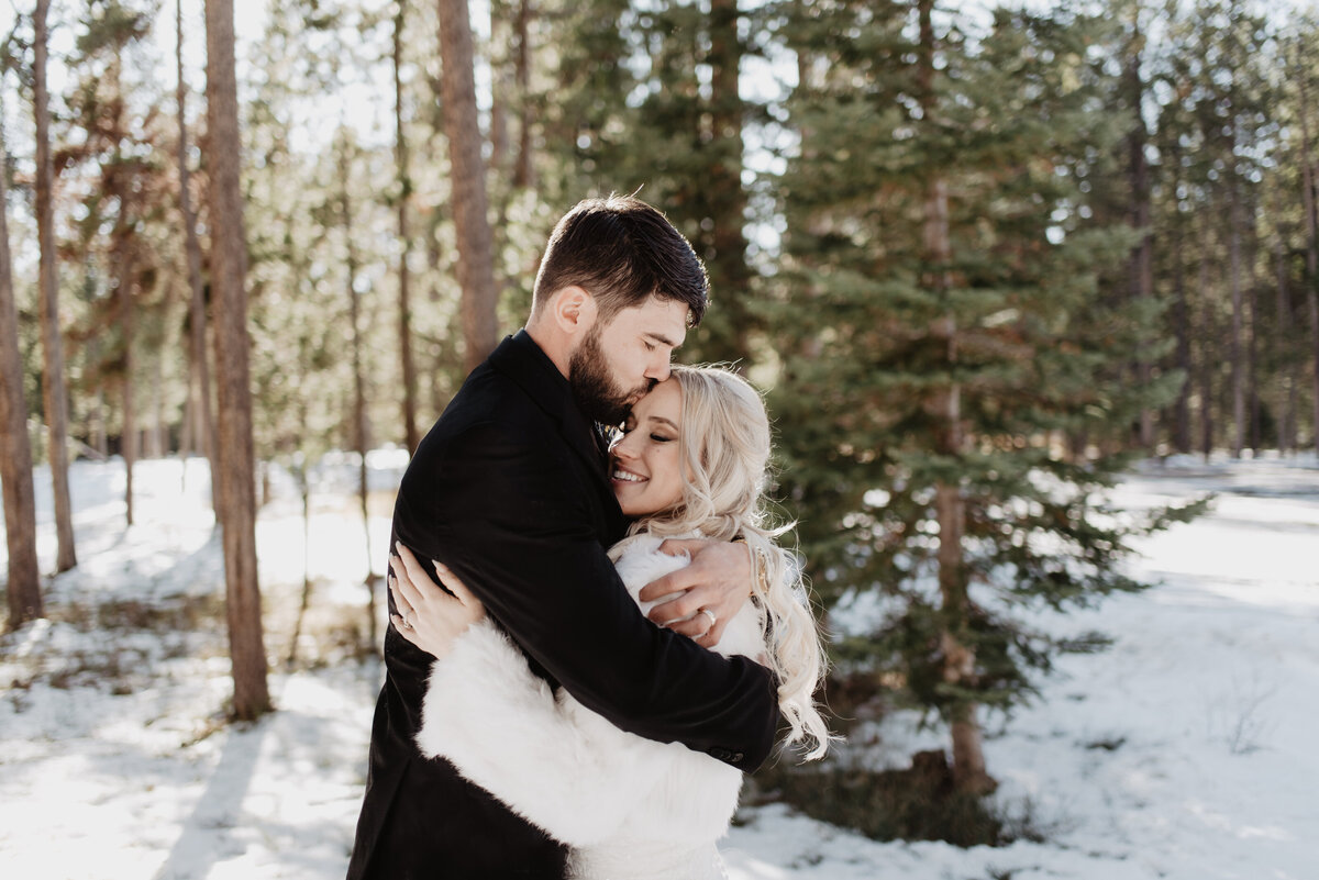 Jackson Hole Photographers capture couple hugging during outdoor bridal portraits