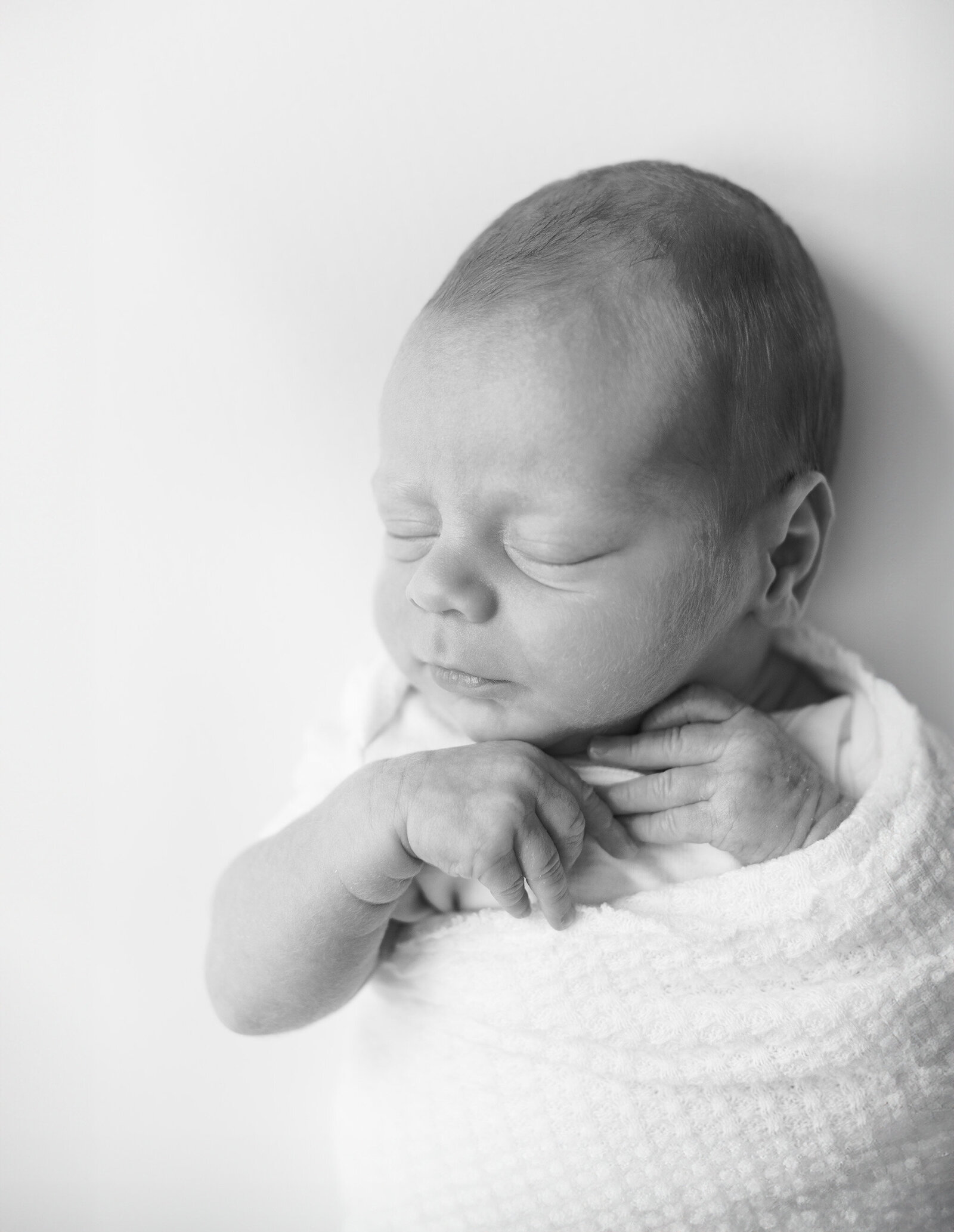black and white close up photograph of sleeping massachusetts newborn