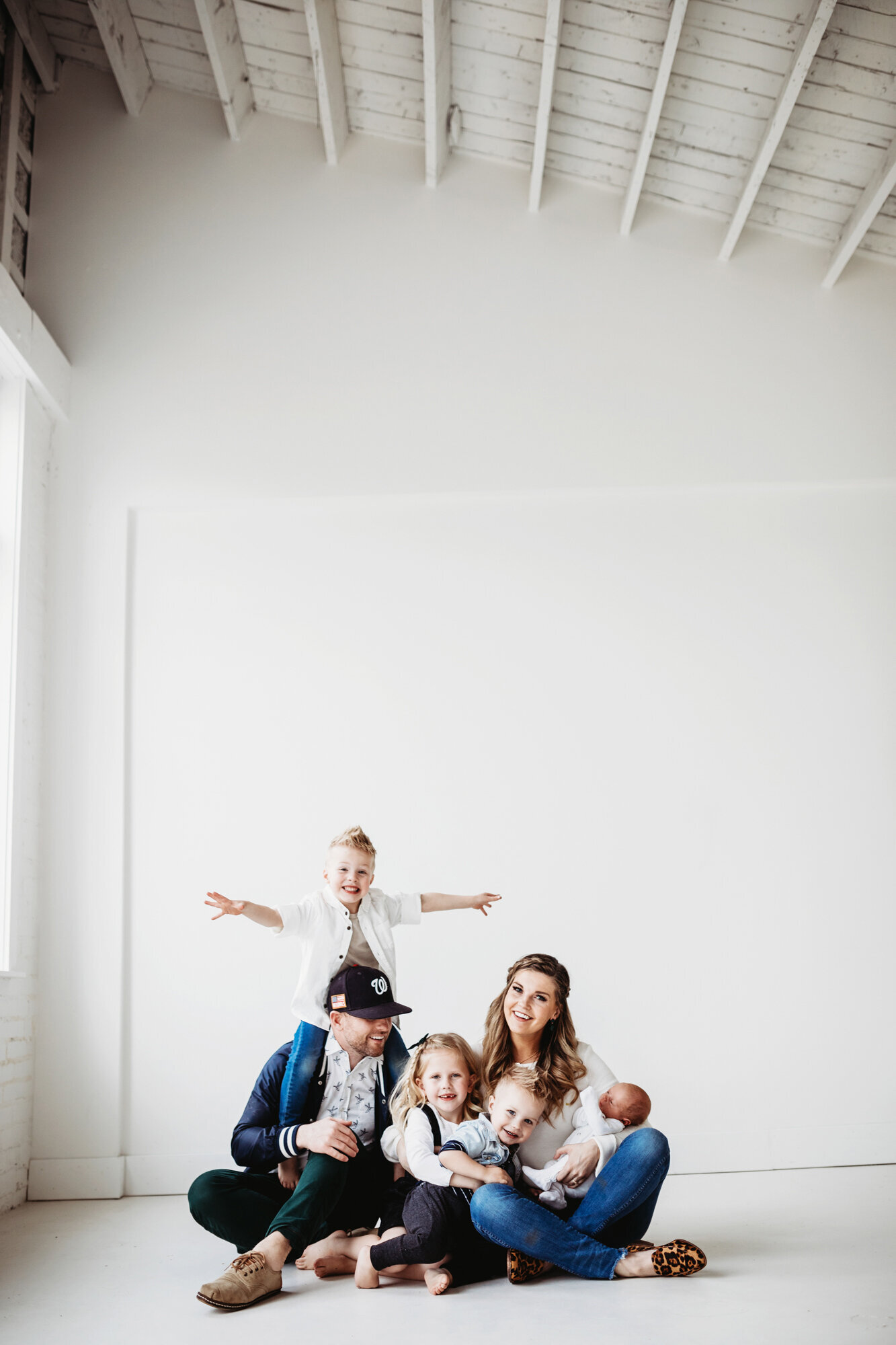 family photography, family of 6 posing in front of white background