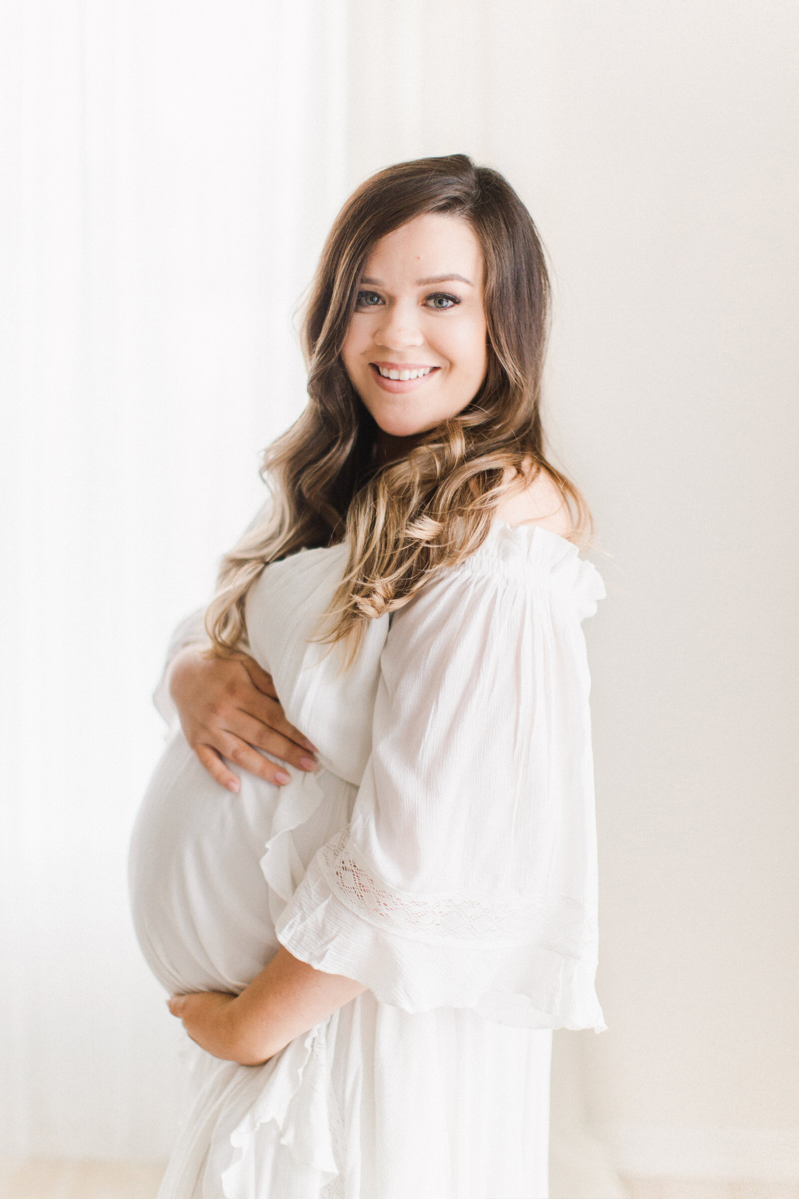 Studio maternity session in free people dress