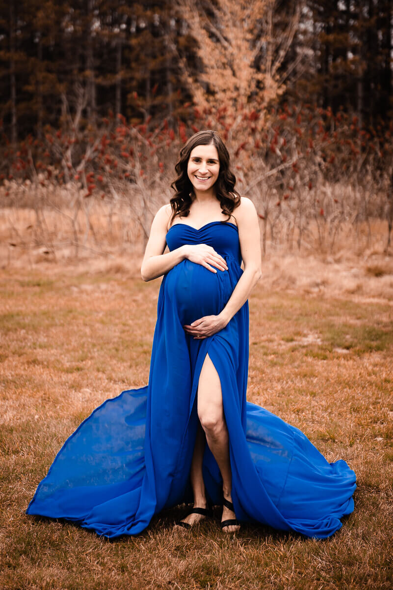 Mother modelling blue gown for Toronto maternity photographer