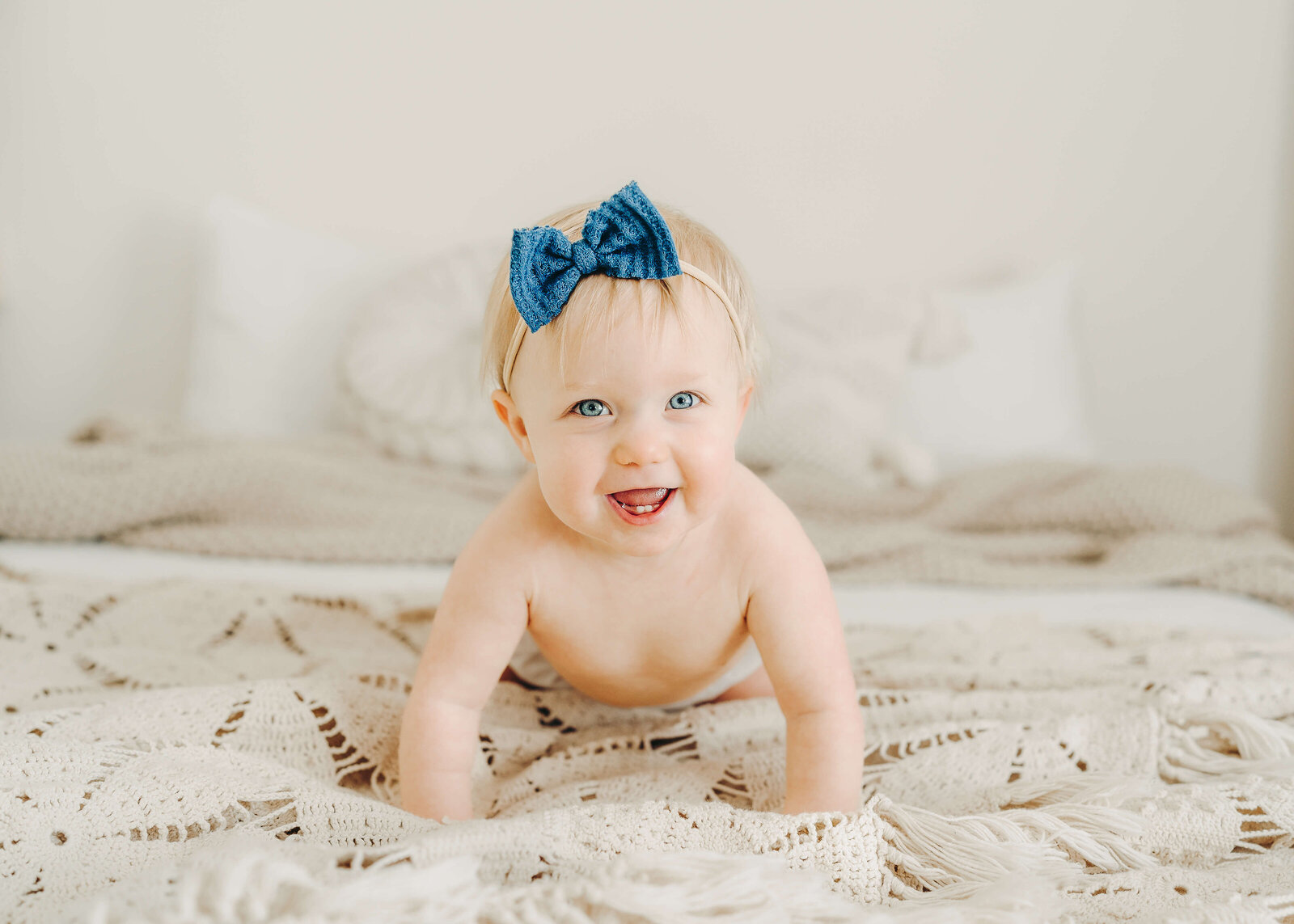 baby smiling and crawling milestone session