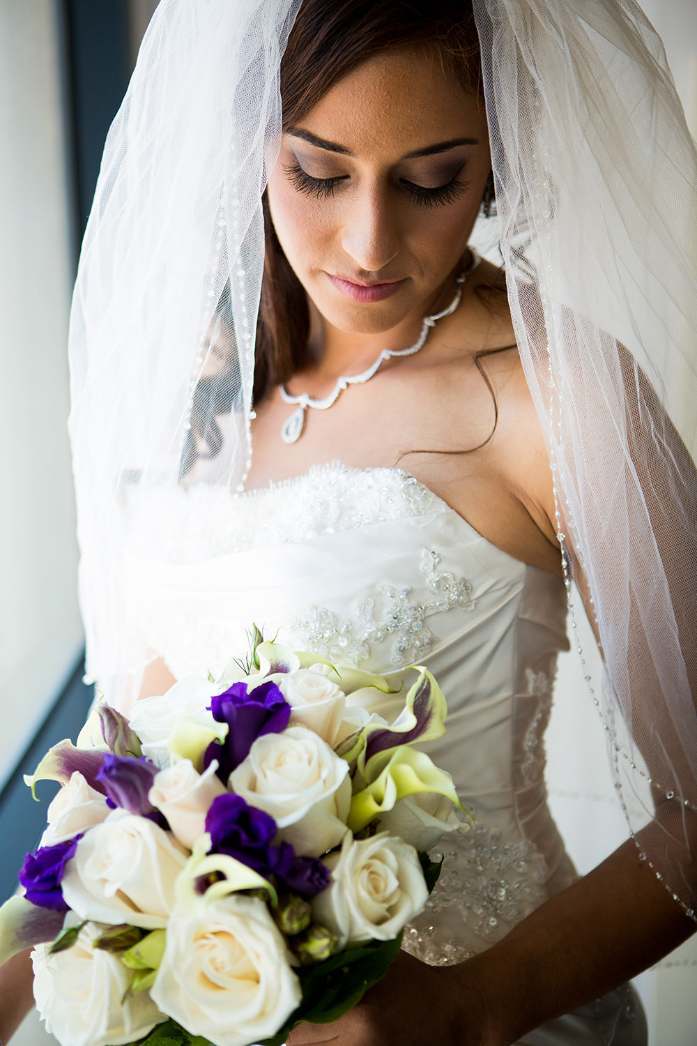 Pensive moment with purple flowers and white roses.