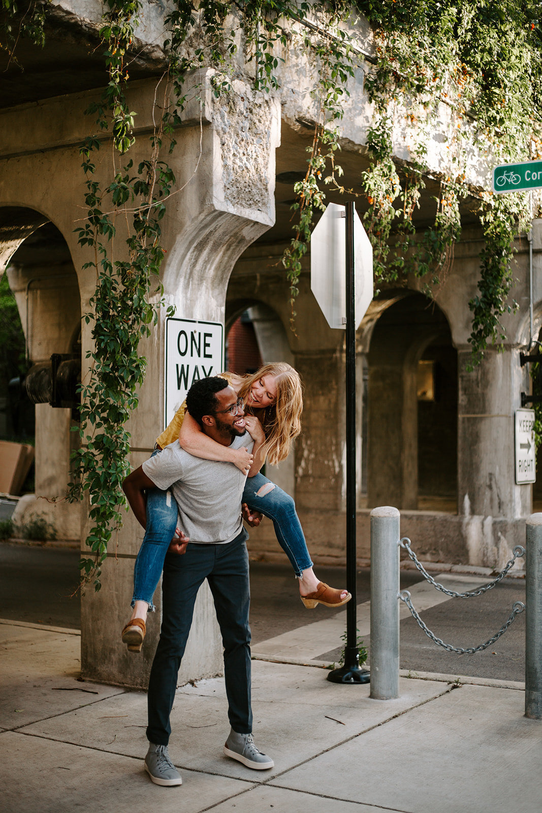 Couple doing a piggy back ride during the streets of Chicago during their engagement session
