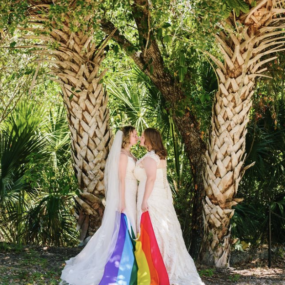 Jackson Hole wedding photographers capture two brides kissing after Jackson Hole elopement
