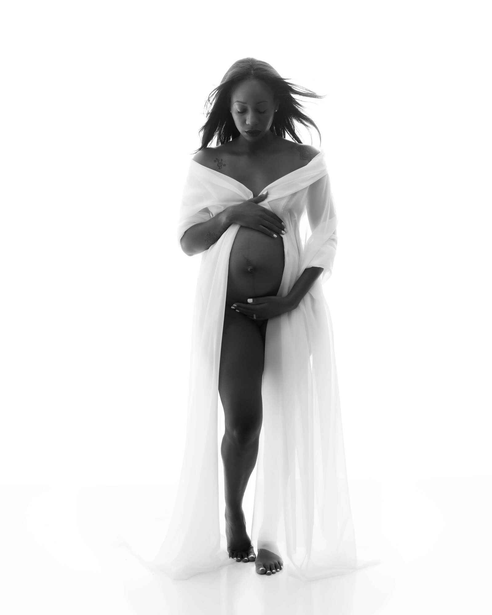 back lit image, black and white, maternity, fabric