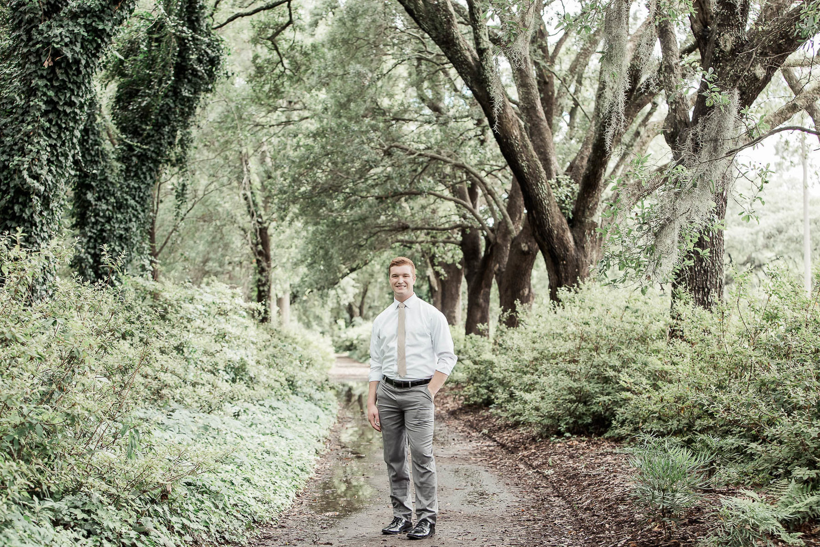 Groom poses under trees, Hampton Park, Charleston, South Carolina