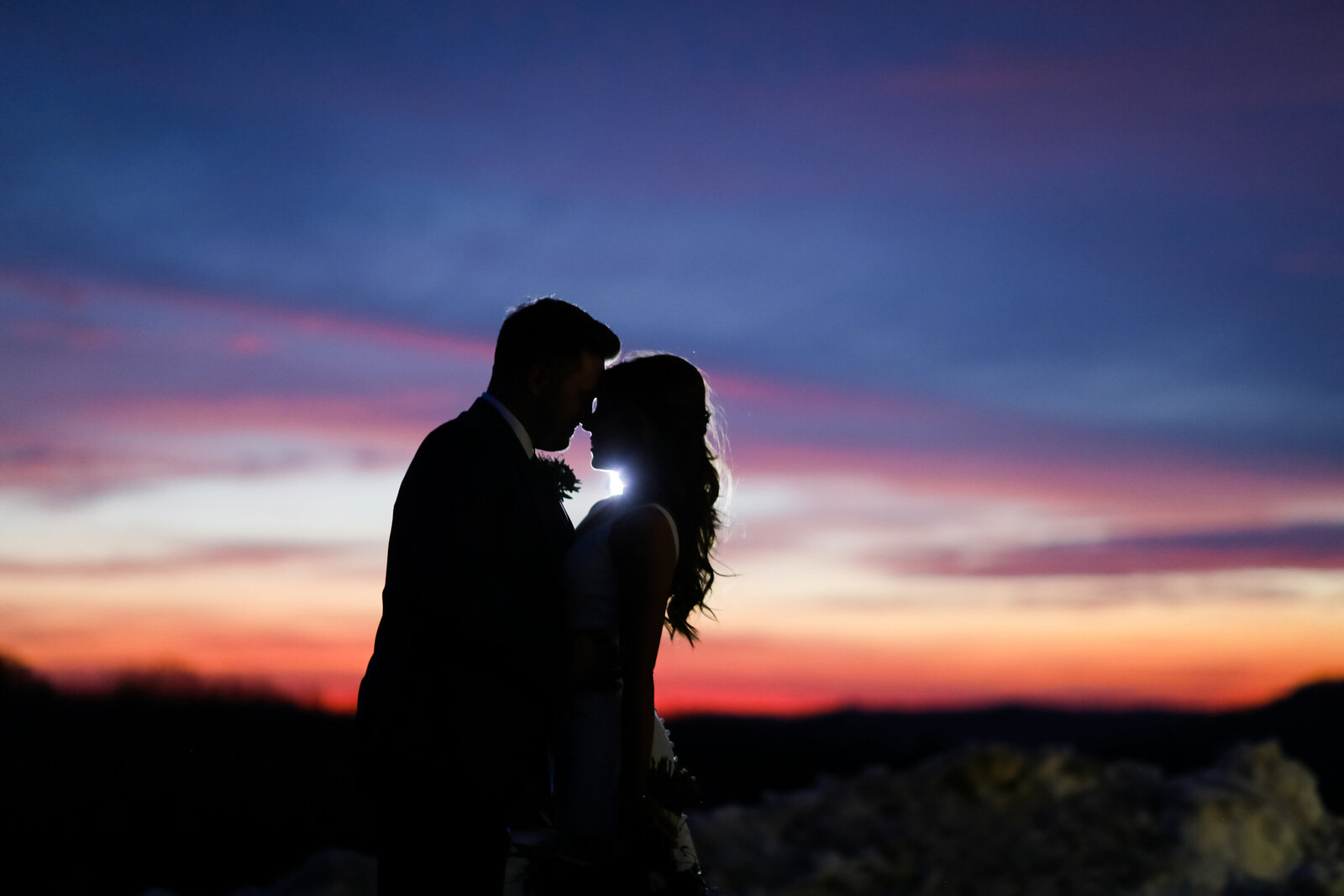 Couple in front of incredible sunset  | Andrew Vick Photography