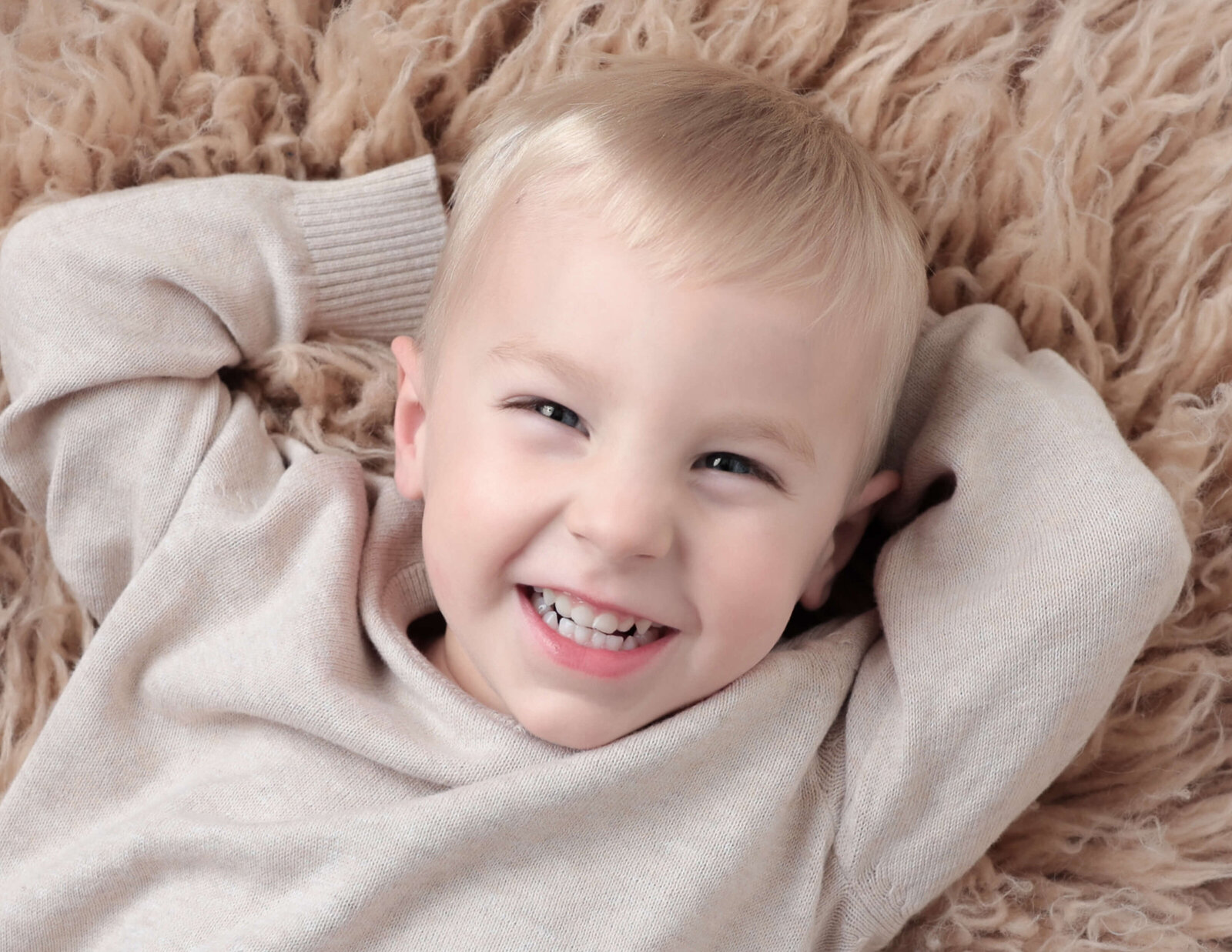 Happy three year old posed at our Rochester, NY studio.