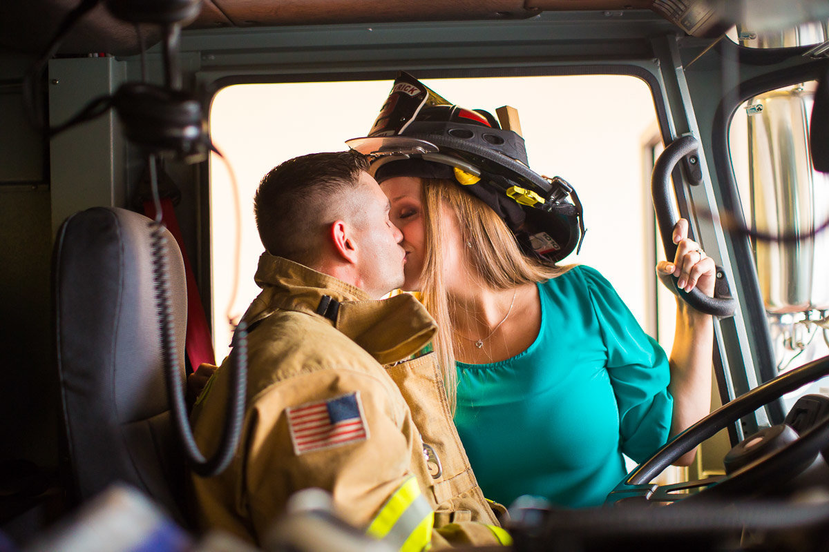 bride and groom on a firetruck in maryland for their wedding