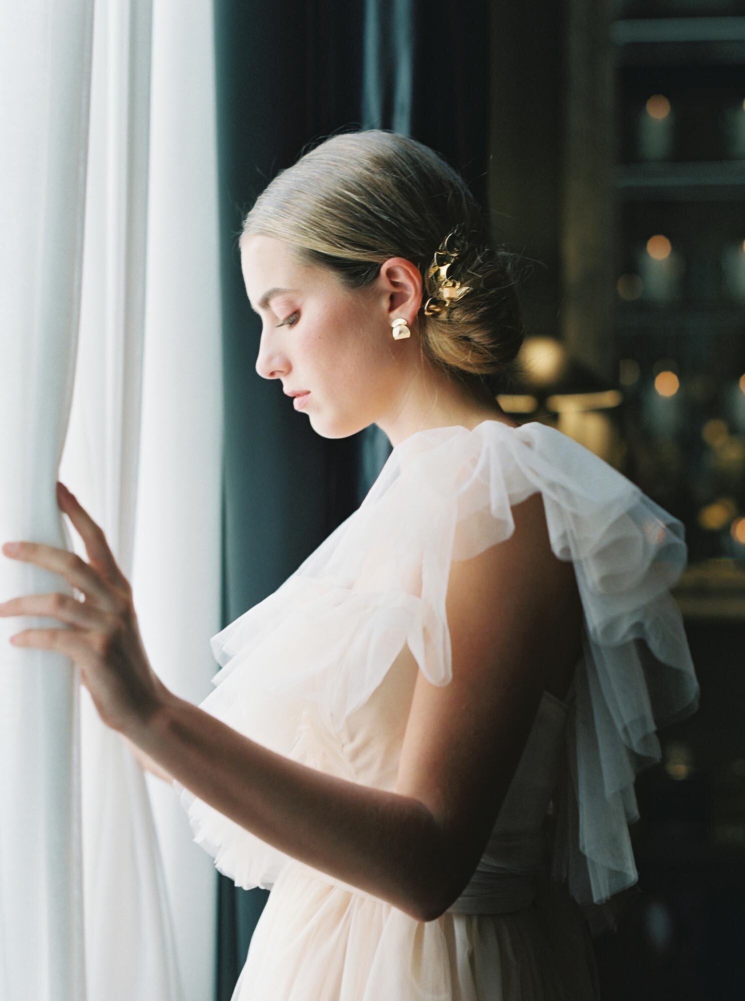 Young bride looking out of the window