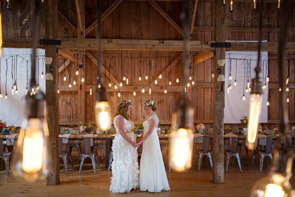Gorgeous rustic tablescape for barn wedding with Edison Bulb light installation at The Barn on Walnut Hill