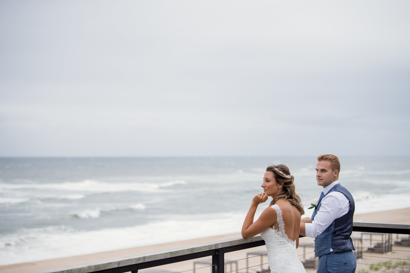 photo bride and groom looking into the ocean at Gurneys Montauk Resort wedding