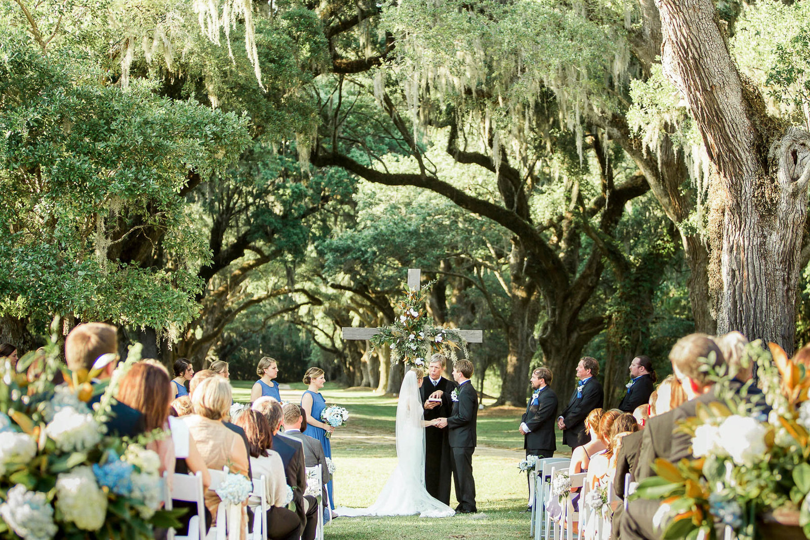 Bride and groom exchange vows, Oakland Plantation, Mt Pleasant, South Carolina. Kate Timbers Photography.