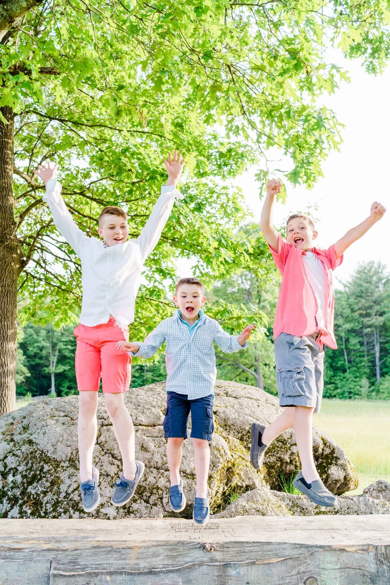 Boys jumping in the air excited for New Hampshire family photos