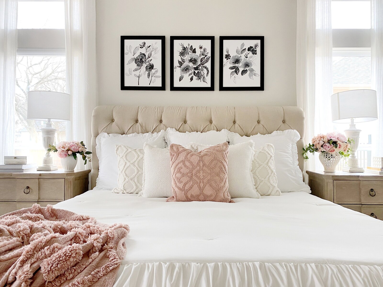 Bedroom space featuring MTH wall art above bed