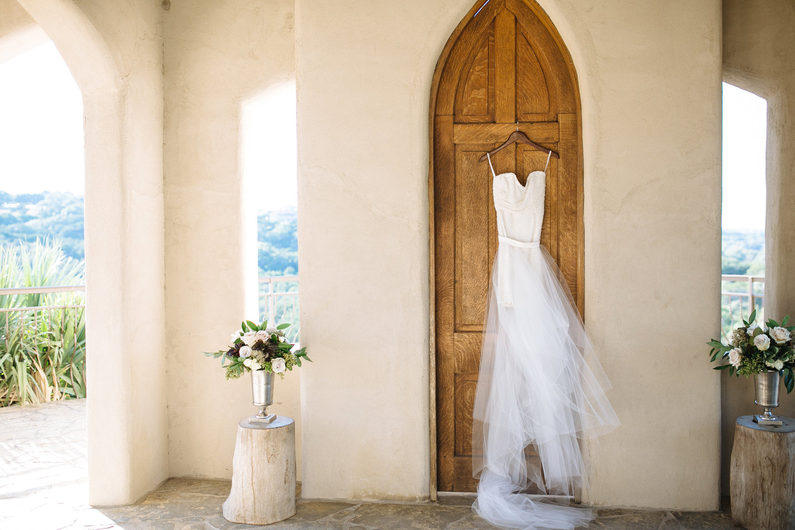 texas hill country wedding venue chapel dulcinea with wedding florals by flower shack blooms and wedding dress by pure magnolia photographed by houston wedding photographer