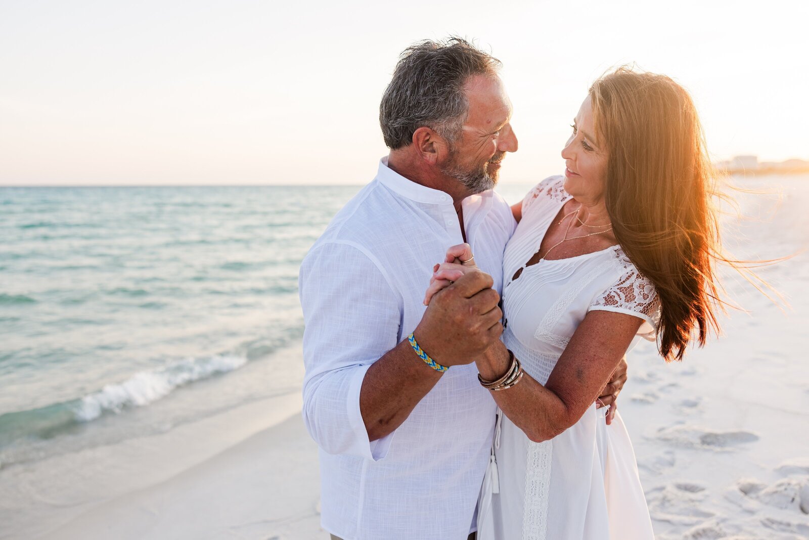 Grandparents dancing on beach during beach vacation photo session by Pensacola Photographer, Jennifer Beal