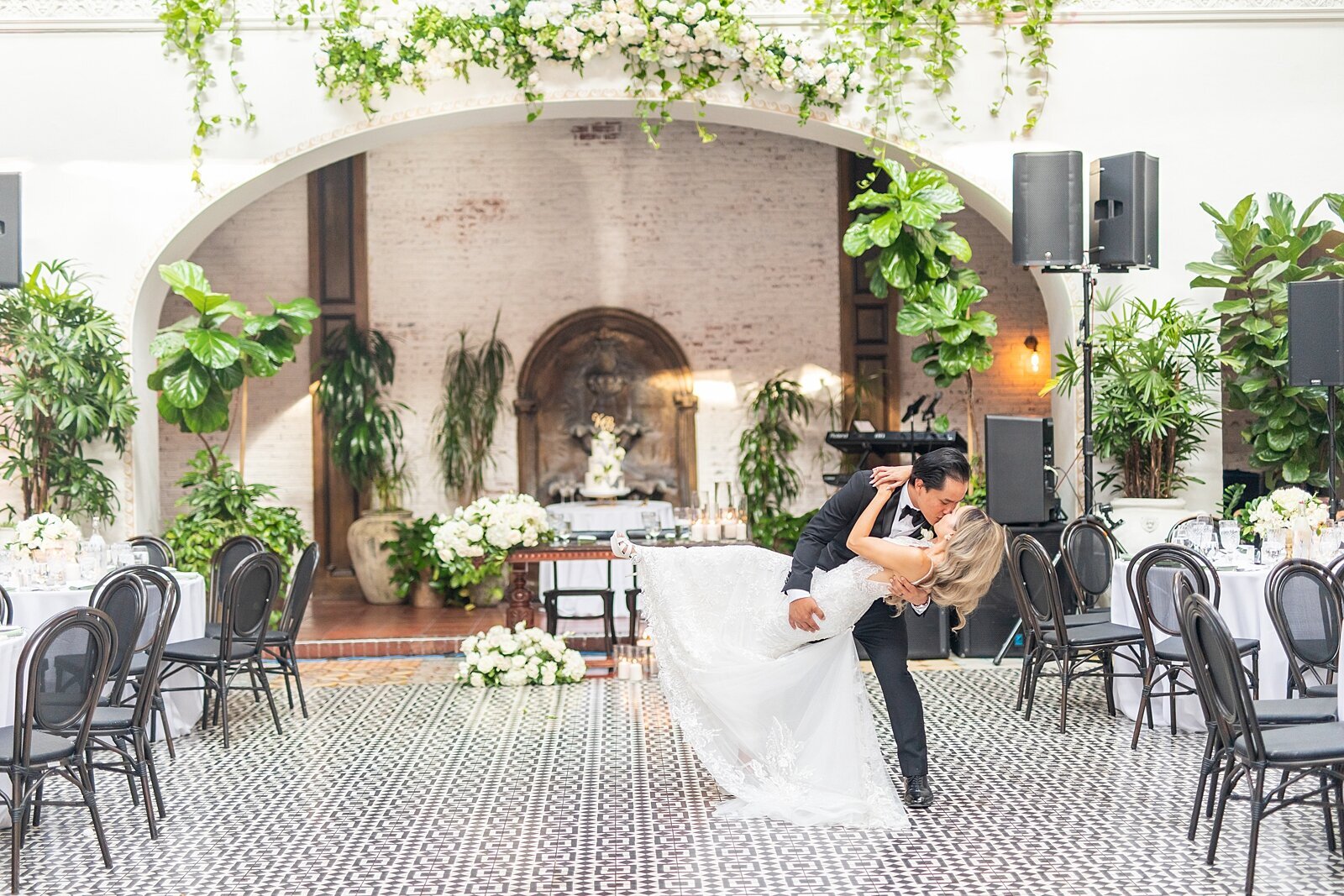 Groom dipping bride after first dance at the Ebell of Long Beach wedding venue.