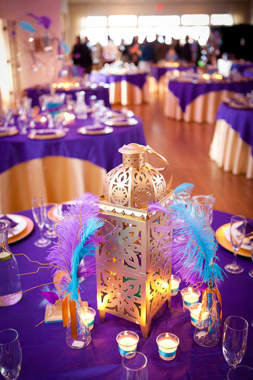 fun reception centerpiece with feathers