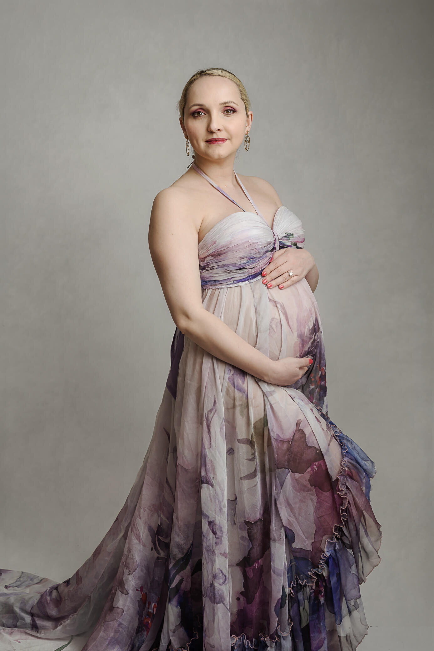 maternity mom weraring floral gown