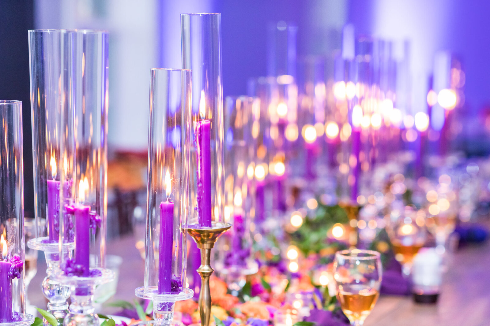 Candles adorn tables at wedding reception.